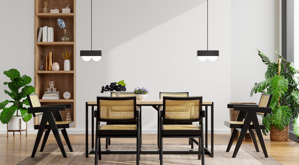 Sala de jantar no estilo comfy com mesa central, cadeiras, plantas e outros objetos.