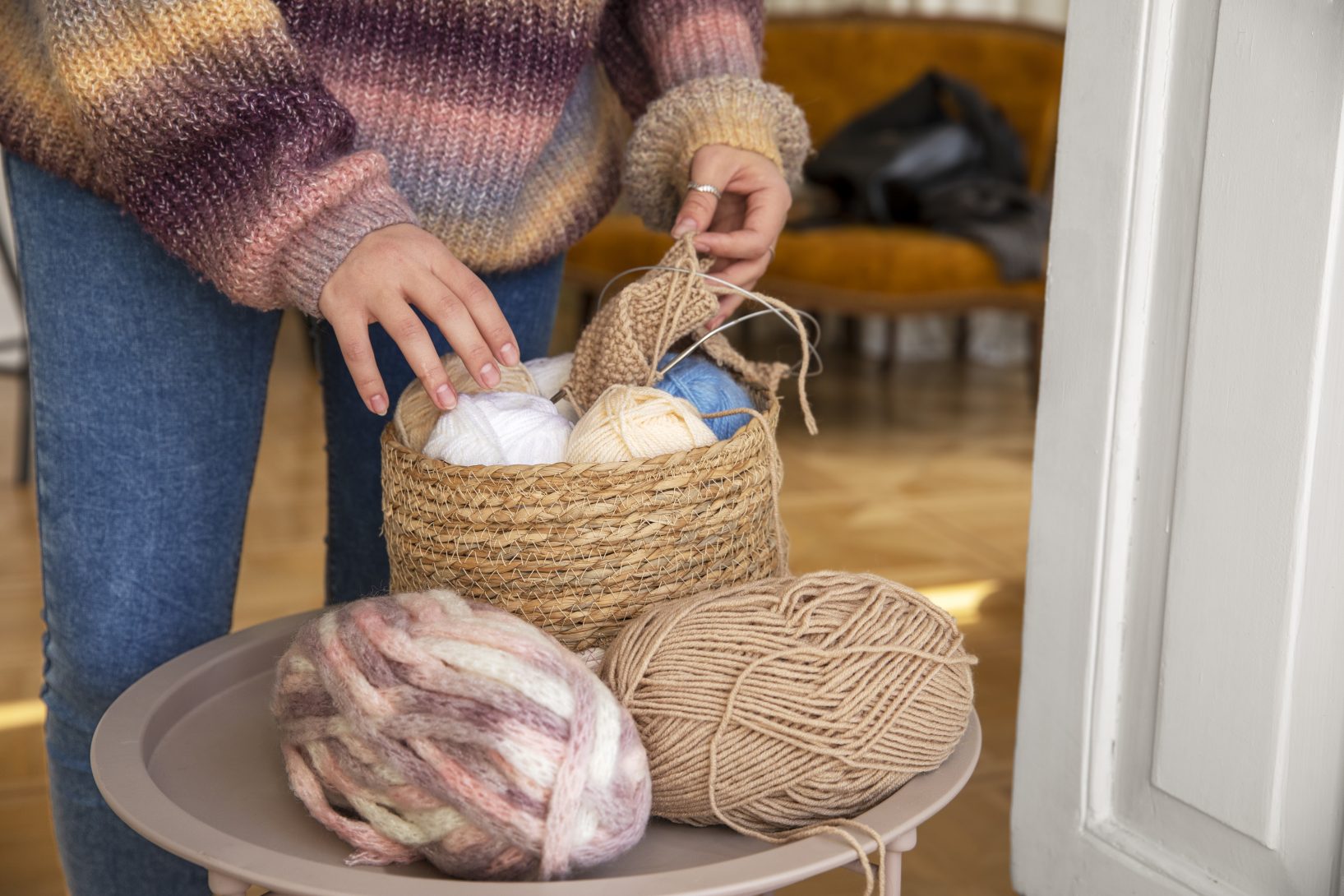 close up hands holding yarn knitting